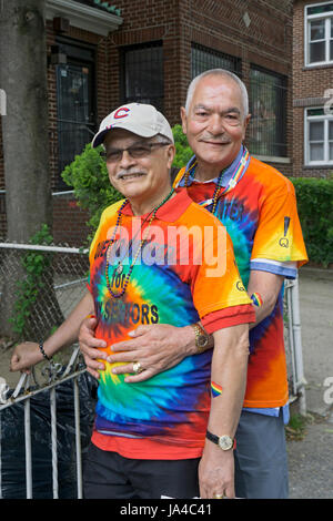 Two men who are members of the Queens Center for Gay Seniors at the Queens Pride Parade in Jackson Heights, Queens, New York City. Stock Photo