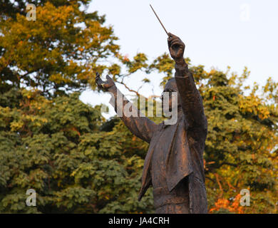 Statue of composer Gustav Holst conducting pose in Imperial Gardens ...