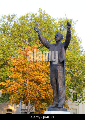 Statue of composer Gustav Holst conducting pose in Imperial Gardens ...