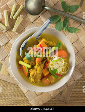 Ca Ri Ga Vietnamese Coconut Chicken Curry with vegetables close-up in a ...
