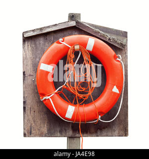 Bright red lifebuoy in wooden case isolated on white Stock Photo