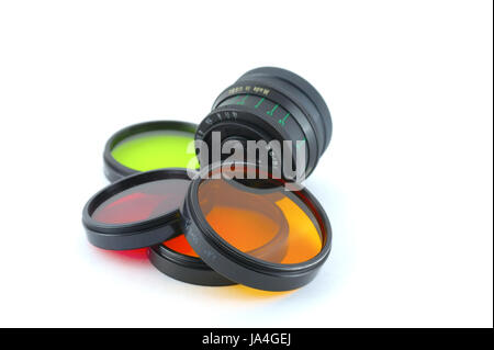 Color filters and old lens over white Stock Photo
