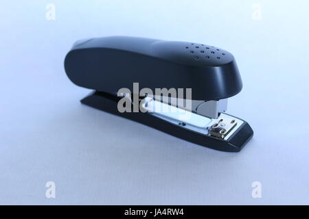 A professional black office stapler on a white background Stock Photo
