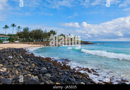Koloa Kauai Hawaii beautiful beach at Brenneck;s Beach with rocks and waves Stock Photo