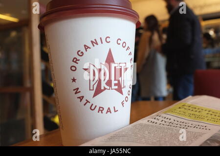 A Pret a Manger coffee cup on a table in Notting Hill, London, England, United Kingdom. May 2017. Stock Photo