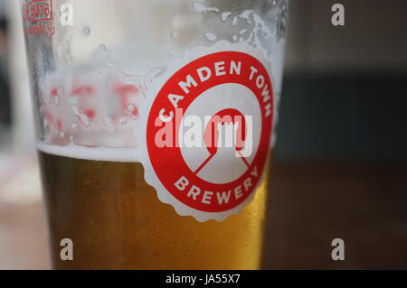 A pint glass with the logo of the Camden Town Brewery on it at a pub in Oxford, England, United Kingdom. June 2, 2017. Stock Photo