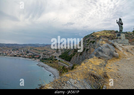 Madonna del Mare (Our Lady of the Sea) statue and Bova Marina Town aerial view - Bova Marina, Calabria, Italy Stock Photo