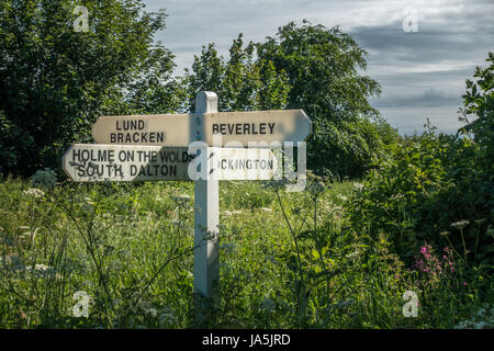 Traditional white signposts in the Yorkshire Wolds for Beverley, Holme on the Wolds, South Dalton, Lund, Bracken and Lockington, UK Stock Photo