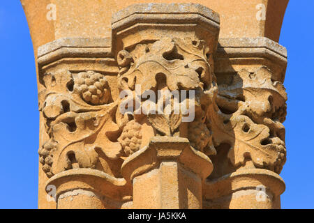 Sculpted entwined vines and grapes decorating the main entrance doorway of the medieval ruins of Orval Abbey at Villers-devant-Orval, Belgium Stock Photo