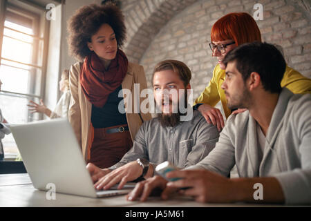 web designers discussing together on meeting Stock Photo