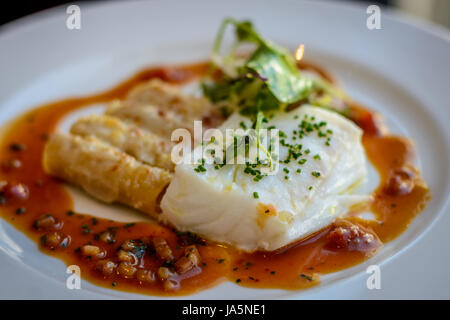 Silver cod, lobster macaroni and  piquillo sauce Stock Photo