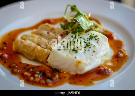 Silver cod, lobster macaroni and  piquillo sauce Stock Photo