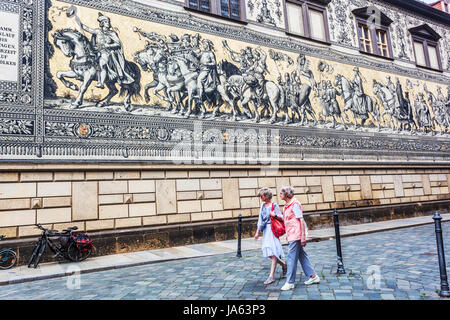 People below Procession of Princes Fürstenzug detail, Dresden, Saxony, Germany, Europe Stock Photo
