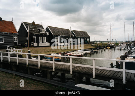 Marken, Netherlands - August 08, 2016. Picturesque traditional houses in the fishing harbour of Marken. It is known for its characteristic wooden hous Stock Photo