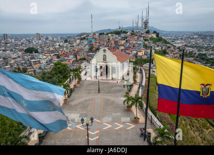 Santa Ana Church on top of Santa Ana hill with Ecuador and city flags - Guayaquil, Ecuador Stock Photo