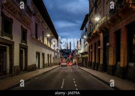 Street of Quito and Basilica del Voto Nacional at night - Quito, Ecuador