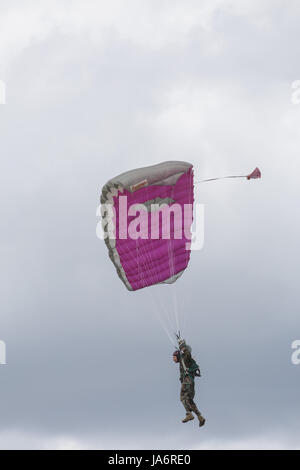 La Ferte Alais, France. 4th June, 2017. A parachutist in the skies above the Aerodrome de Cerny, La Ferte Alais. Credit: Julian Elliott/Alamy Live News Stock Photo