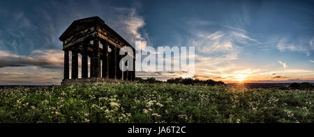The sun sets behind Penshaw Monument, a half size replica of the Temple of Hephaestus in Athens. The monument stands on a hill in Sunderland in the north east of England, and was built to honour Lord Lambton, the then local MP. Stock Photo