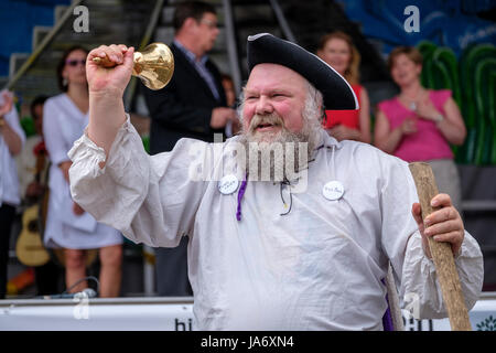 London, Ontario, Canada. 4th June, 2017. Fiesta London! Mexican festival celebrating the sounds, culture, and food of Mexico at the Covent Garden Market, in downtown London, Ontario. Held annually, the festival brings together a variety of performers, colourful folkloric dancers, singers, and entertainment from throughout Latin America. Silver bearded town crier with handbell and tricorne hat announcing the start of the music festival. Credit: Rubens Alarcon/Alamy Live News Stock Photo