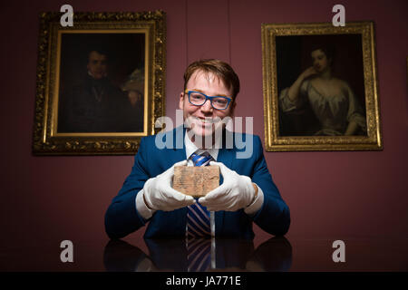 (170825) -- SYDENY, Aug. 25, 2017 (Xinhua) -- Photo taken on April 17, 2017 shows Dr. Daniel Mansfield, an Australian mathematician who deciphered the Babylonian clay tablet in New York, the United States. The mystery of a famous 3,700-year-old Babylonian clay tablet, once owned by the real 'Indiana Jones,' has been unlocked by Daniel Mansfield. It was revealed on Aug. 25, 2017. (Xinhua/University of New South Wales) (dtf) Stock Photo