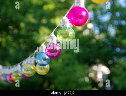 Colorful vitreous bulbs. Lamps on wire. Stock Photo