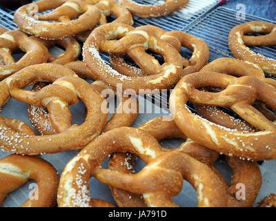 A few of pretzel, cracknels, fresh and fragrant, tasty warm, crusty French bread, bakery,street food Stock Photo