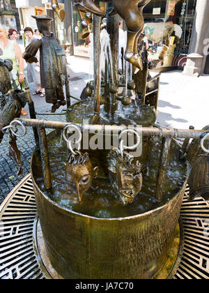 AACHEN, GERMANY - JUNE 27: Fountain of Puppets in Aaachen, Germany on June 27, 2010. It was created in 1975 by the Aachen sculptor Boniface Stirnberg. Stock Photo