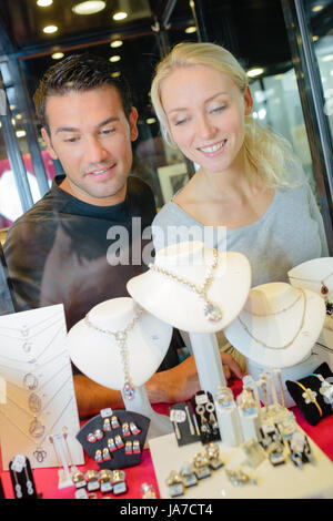 stylish couple shop window jewelry shop Stock Photo