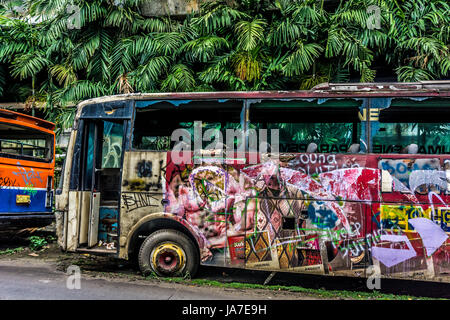 Burnt Bus wrackage parked on side the street photo taken in Jakarta Indonesia Stock Photo