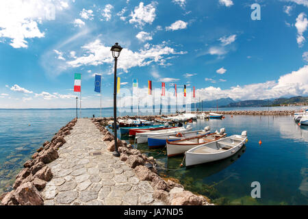 Summer morning on Lake Garda. Italy, Europe. It is located in NorthernItaly, about half-way between Brescia and Verona, and between Venice and Milan. Stock Photo