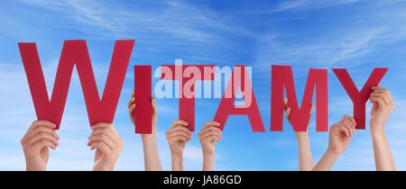 Many Hands Holding the Polish Word Witamy Which Means Welcome in the Sky Stock Photo