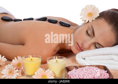 attraktve young woman gets a hot stone massage Stock Photo