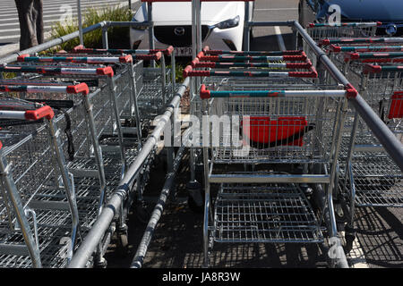 Rothwell, Redcliffe, Australia: Bunnings Warehouse hardware shopping trolleys in car park Stock Photo