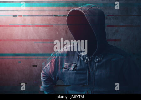 Cyber crime and network security concept, unrecognizable faceless man wearing hooded jacket with digital glitch effect Stock Photo