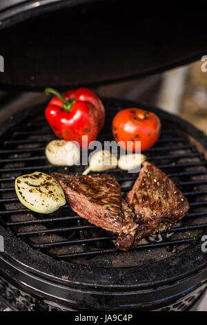 Wagyu beef steak with vegetables on hot grill. Barbecue. Restaurant Stock Photo