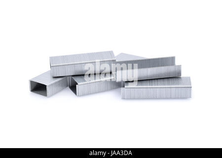 Stack of metal staples isolated on white background. Stock Photo