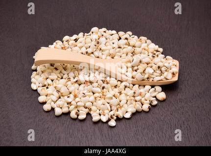 millet grains on the wooden floor Stock Photo