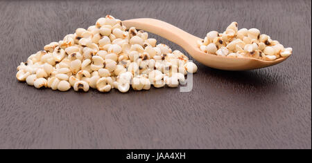 millet grains on the wooden floor Stock Photo