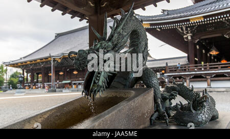 A dragon water fountain at a Buddhist temple in Kyoto, Japan Stock Photo