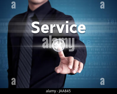 Business man pointing at Customer service icon on a virtual screen Stock Photo