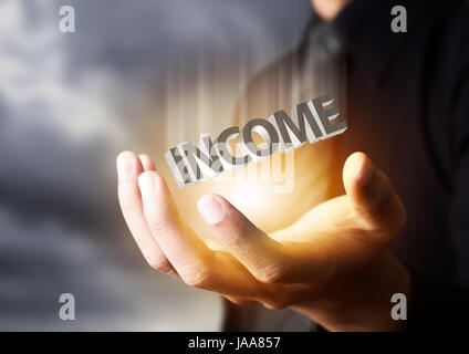 Businessman showing text income concept Stock Photo