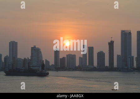 Sun setting over the skyline of  Cartagena in Colombia, Caribbean, South America,  also known as Cartagena de Indias. Stock Photo