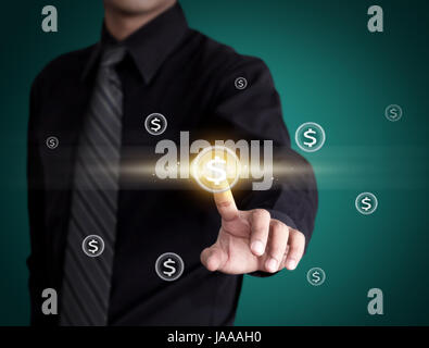 Business man pressing money icon Stock Photo