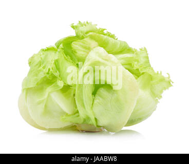 A single head of crisp green iceberg lettuce on a textured gray ...