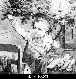 Toddler happy under the Christmas tree - engraving from XIX century Stock Photo