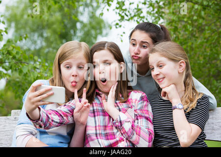 Outdoor Portrait Of Group Of Friends Taking Selfie In The Street. Stock  Photo, Picture and Royalty Free Image. Image 111625906.