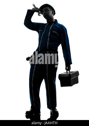 one caucasian repairman worker tired fatigue silhouette in studio on white background Stock Photo