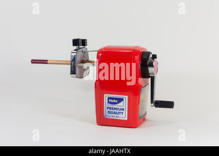 Desk-mounted type pencil sharpening machine by Helix, with pencil. Isolated on white. Stock Photo