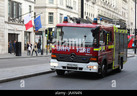 A London Fire Brigade emergency vehicle moving along Piccadilly, central London, UK, in November, 2014. Stock Photo