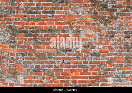 Brick wall made of  old rough red bricks Stock Photo